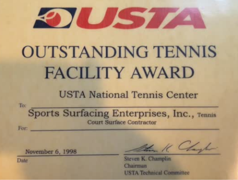 A certificate for the USTA Outstanding Tennis Facility Award presented to Sports Surfacing Enterprises, Inc. by the USTA National Tennis Center, dated November 6, 1998.