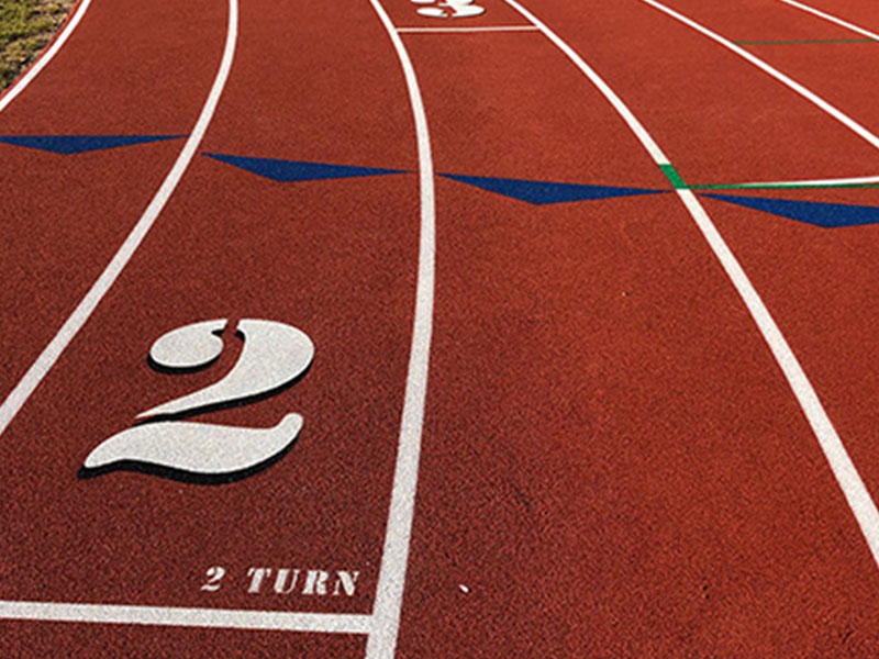 A running track with two numbers on it.